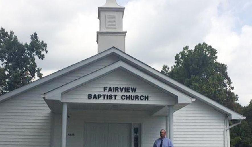 In this Sept. 14, 2016 photo, Pastor Ken Sharp stands on the steps at Fairview Baptist Church in Creal Springs, Ill. The church is celebrating its 136th anniversary and its leaders are thankful for that history and are striving to remain relevant to its small congregation while attracting new members, particularly younger ones. (Stephanie Esters/The Southern, via AP)