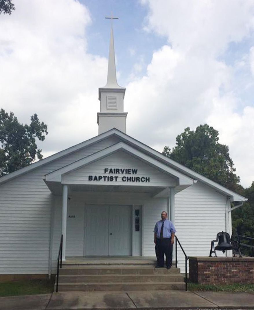In this Sept. 14, 2016 photo, Pastor Ken Sharp stands on the steps at Fairview Baptist Church in Creal Springs, Ill. The church is celebrating its 136th anniversary and its leaders are thankful for that history and are striving to remain relevant to its small congregation while attracting new members, particularly younger ones. (Stephanie Esters/The Southern, via AP)