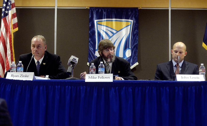 FILE - In this Oct. 21, 2014, file photo, Libertarian Mike Fellows, center, flanked by Republican Ryan Zinke, left, and Democrat John Lewis, answers a question during the U.S. House debate in Heritage Hall on the Great Falls College Montana State University Campus in Great Falls, Mont. Missoula County sheriff's officials said Fellows died in a head-on collision with another vehicle on Montana Highway 200 on Monday, Sept. 19, 2016. (Rion Sanders/The Great Falls Tribune via AP, File)