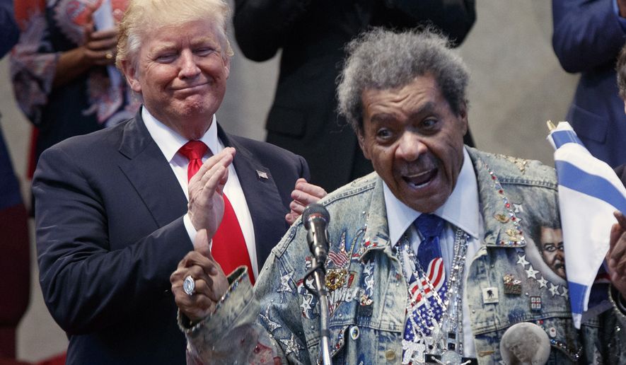Republican presidential candidate Donald Trump applauds as he is introduced by boxing promoter Don King prior to speaking at the Pastors Leadership Conference at New Spirit Revival Center, Wednesday, Sept. 21, 2016, in Cleveland, Ohio. (AP Photo/ Evan Vucci)
