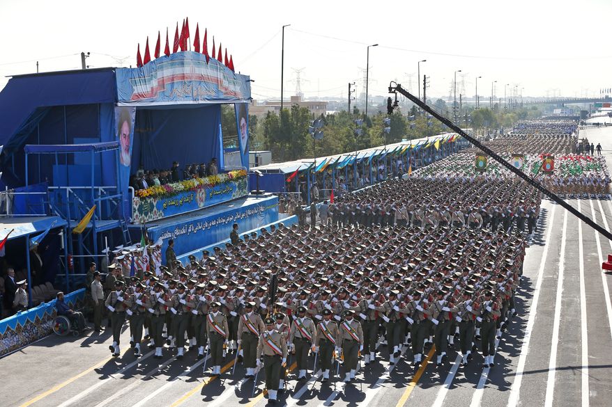 Iranian armed forces members march in a military parade marking the 36th anniversary of Iraq's 1980 invasion of Iran, in front of the shrine of late revolutionary founder Ayatollah Khomeini, just outside Tehran, Iran, Wednesday, Sept. 21, 2016. (AP Photo/Ebrahim Noroozi) ** FILE **