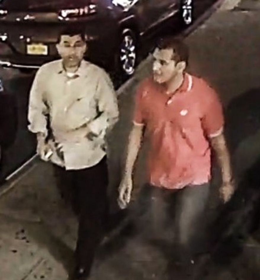 The image released by the FBI shows two men walking along West 27th Street between 6th Avenue and 7th Avenue between 8 and 9 p.m. Saturday. (Source: FBI)
