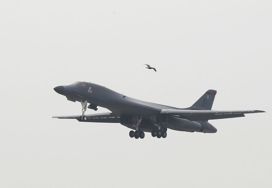 A U.S. Air Force B-1B bomber from Andersen Air Force Base, Guam, flies over Osan Air Base in Pyeongtaek, South Korea, Wednesday, Sept. 21, 2016. (Seo Myung-gon/Yonhap via AP)