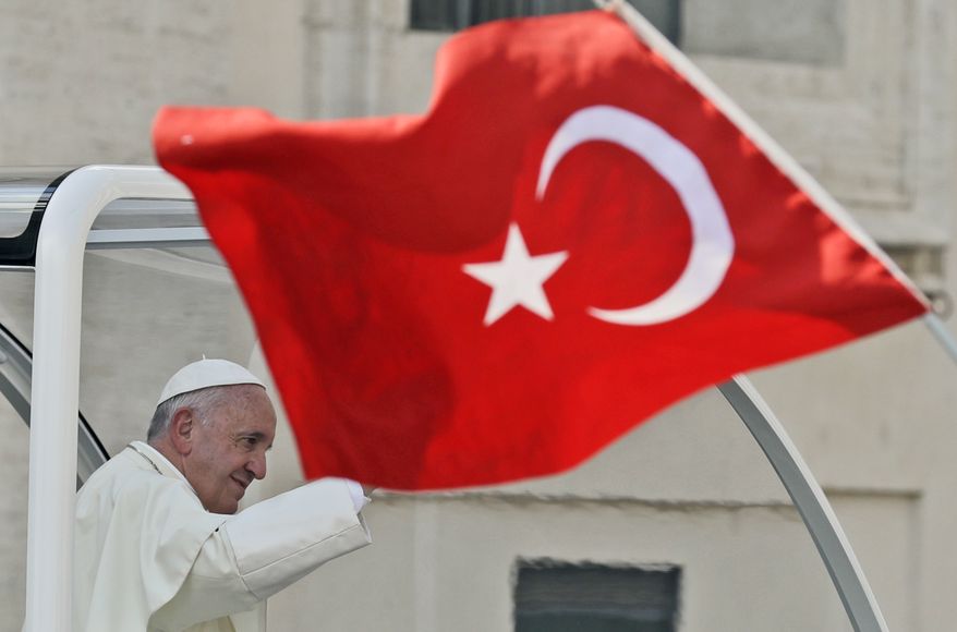 A Turkish flag waves as Pope Francis leaves at the end of a general audience he held in St. Peter's Square, at the Vatican, Wednesday, Sept. 21, 2016. (AP Photo/Andrew Medichini)