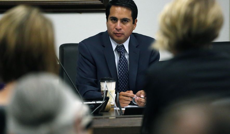 State Rep. Dan Pabon, D-Denver, hears testimony during a hearing of the Colorado state House Marijuana Cost-Benefit Analysis Interim Committee, at the state Capitol, in Denver, Wednesday, Sept. 21, 2016. A panel of state lawmakers voted 5-0 Wednesday, Sept. 21, 2016 to endorse the addition of PTSD to Colorado's 2000 medical pot law. The vote doesn't have legal effect; it's just a recommendation to the full Legislature, which resumes work in January. (AP Photo/Brennan Linsley)