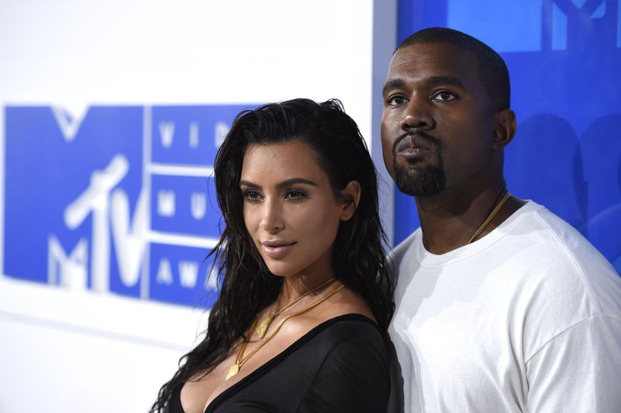 FILE - In this Aug. 28, 2016 file photo, Kim Kardashian West, left, and Kanye West arrive at the MTV Video Music Awards in New York. The couple rarely make a move that isn't heavily documented on social media, either by themselves, their fans or all those people who love to hate them. The two married on May 24, 2014, in a lavish ceremony in Florence, Italy. (Photo by Evan Agostini/Invision/AP, File)