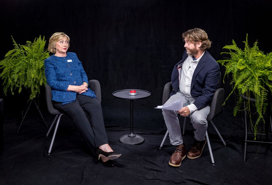 In this undated image released by FunnyorDie.com, Democratic presidential candidate Hillary Clinton, left, appears with actor-comedian Zach Galifianakis during an appearance for the online comedy series, "Between Two Ferns." (FunnyorDie.com via AP)