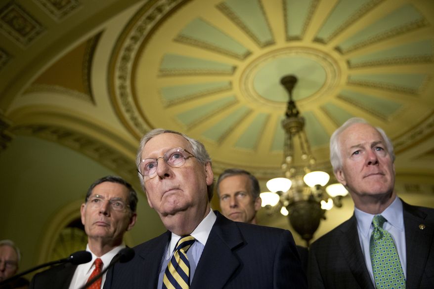 FILE - In tis June 21,2016 file photo, Senate Majority Leader Mitch McConnell of Ky., accompanied by, from left, Sen. John Barrasso, R-Wyo., Sen. John Thune, R-S.D., and Senate Majority Whip John Cornyn of Texas, listen to a question during a news conference on Capitol Hill in Washington. Democrats are criticizing the latest Republican version of legislation that&#39;s needed to avoid a government shutdown next weekend. Sen. Harry Reid of Nevada told reporters that McConnell will unveil the stopgap spending bill and a long-delayed bill to combat the Zika virus on Thursday, Sept, 22, 2016, but that Democrats haven&#39;t signed on to the measure. House Minority Leader Nancy Pelosi said Democrats in that chamber won&#39;t back the measure, either.  (AP Photo/Alex Brandon, File)
