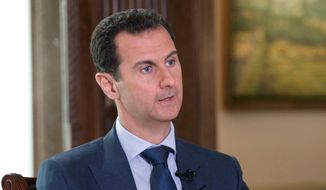 In this Wednesday, Sept. 21, 2016, photo released by the Syrian Presidency, Syrian President Bashar Assad speaks to The Associated Press at the presidential palace in Damascus, Syria. Assad said U.S. airstrikes on Syrian troops in the country&#39;s east were definitely intentional, lasting for an hour, and blamed the U.S. for the collapse of a cease-fire deal brokered with Russia. (Syrian Presidency via AP)