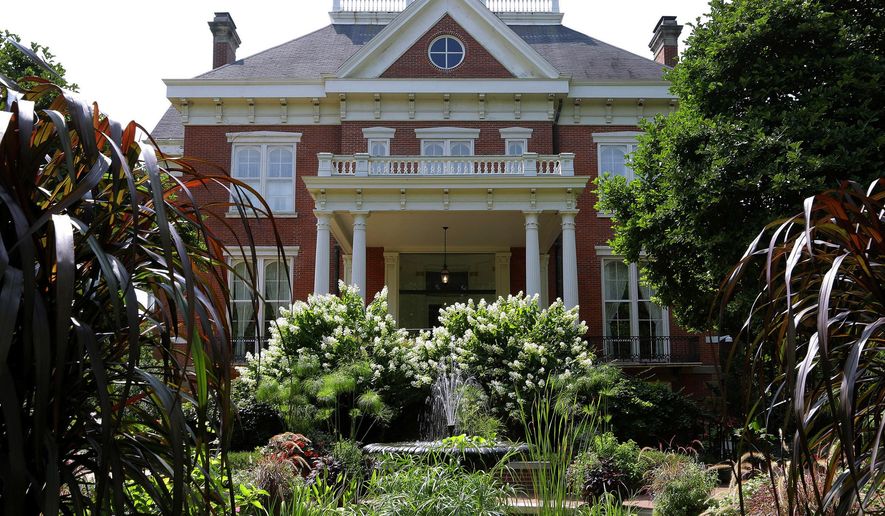 File - In this Aug. 28, 2014, file photo, landscaping is maintained at the Illinois Executive Mansion in Springfield, Ill. An agreement shows that a privately funded renovation of the Illinois Executive Mansion in Springfield will follow wage and bidding rules required of traditional taxpayer-funded construction projects. (AP Photo/Seth Perlman, File)