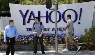 FILE - In this June 5, 2014, file photo, people walk in front of a Yahoo sign at the company&#39;s headquarters in Sunnyvale, Calif. Yahoo says the personal information of 500 million accounts have been stolen in a massive security breakdown that represents the latest setback for the beleaguered internet company. The breach disclosed on Thursday, Sept. 22, 2016, dates back to late 2014. Yahoo is blaming the hack on a “state-sponsored actor.” (AP Photo/Marcio Jose Sanchez, File)