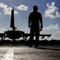 In this Thursday, Sept. 22, 2016, photo, a British soldier walks by a Typhoon aircraft before take off for a mission in Iraq, at  RAF Akrotiri, near the southern coastal city of Limassol, in Cyprus.  British Tornado and Typhoon aircraft stationed at a U.K. air base in Cyprus are pounding Islamic State targets ahead of a major offensive by Iraqi security forces next month to recapture the key northern city of Mosul from IS militants, a senior Royal Air Force officer says. (AP Photo/Petros Karadjias, Pool) **FILE**