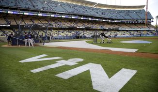 Hall of Fame Los Angeles Dodgers broadcaster Vin Scully&#39;s initials are painted on the field at Dodger Stadium before the team&#39;s baseball game against the Colorado Rockies, Friday, Sept. 23, 2016, in Los Angeles. Scully&#39;s final game at the stadium will be Sunday. (AP Photo/Jae C. Hong)