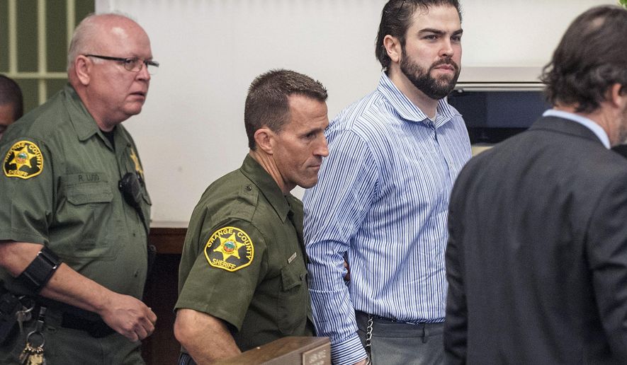Orange County Sheriff deputies lead Daniel Wozniak into Superior Court, Friday, Sept. 23, 2016 in Santa Ana, Calif. Daniel Patrick Wozniak, who killed Samuel Herr and Julie Kibuishi as part of a plot to steal money to pay for his wedding and honeymoon was sentenced to death Friday. (Mark Rightmire/The Orange County Register via AP)