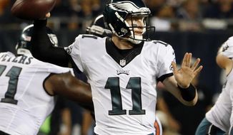 FILE - In this Monday, Sept. 19, 2016, file photo, Philadelphia Eagles quarterback Carson Wentz (11) throws a pass during the first half of an NFL football game against the Chicago Bears in Chicago. Wentz&#39;s excellent start is nothing compared to what Ben Roethlisberger did his rookie season. two quarterbacks share an agent and other similarities. They&#39;ll meet Sunday when the Philadelphia Eagles  host their intrastate rival Pittsburgh Steelers. (AP Photo/Nam Y. Huh, File