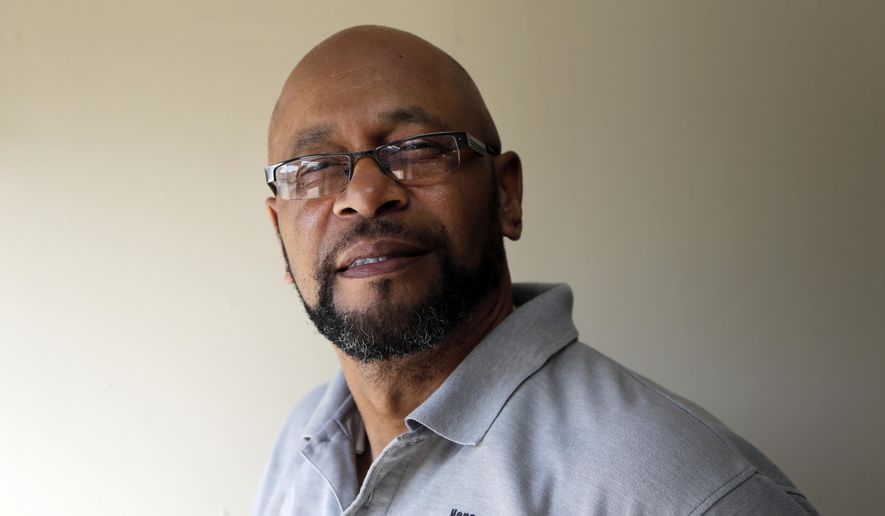 In this Sept. 15, 2016, photo, the Rev. Moses Colbert poses for a photo at his church in Gastonia, N.C. As Americans prepare to cast ballots for the next president, the voting process has never been more convoluted. A federal appeals court over the summer struck down several parts of a North Carolina law that not only required voters to show photo ID but also reduced early voting and eliminated same-day registration during the early voting period. Colbert, a black pastor from Kings Mountain, N.C., was among those who challenged the law after finding himself unable to vote in 2014. (AP Photo/Chuck Burton)