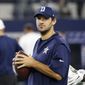Dallas Cowboys quarterback Tony Romo carries a football as he watches his team warm up before an NFL football game against the Chicago Bears on Sunday, Sept. 25, 2016, in Arlington, Texas. (AP Photo/Ron Jenkins)