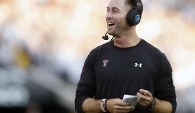 FILE - In this Sept. 17, 2016, file photo, Texas Tech coach Kliff Kingsbury cheers after Jonathan Giles scored a touchdown during an NCAA college football game against Louisiana Tech in Lubbock, Texas. With all the non-conference games completed, there will be only head-to-head matchups in the Big 12 over the last 10 weekends of the regular season. “That’s the fun that&#39;s the fun part about conference. It doesn’t matter what you do those first three games,” Kingsbury said Monday, Sept. 26, 2016. (Brad Tollefson/Lubbock Avalanche-Journal, File)