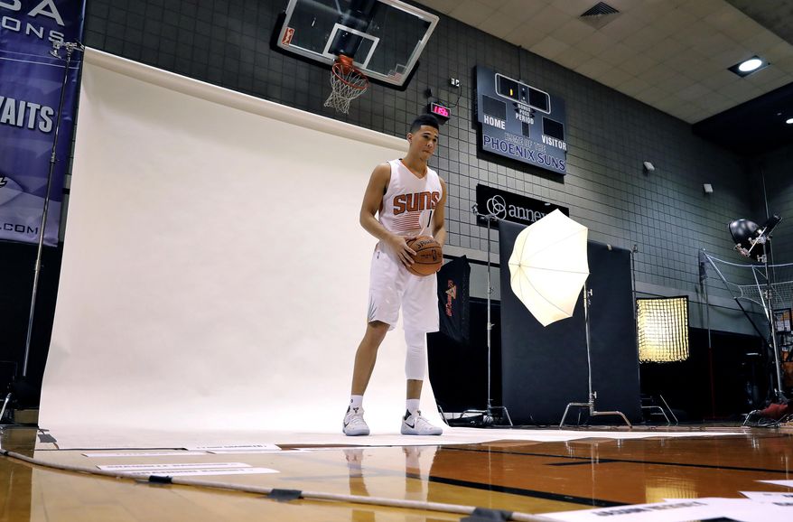 Phoenix Suns' Devin Booker poses for a photo, Monday, Sept. 26, 2016, during the NBA team's media day in Phoenix. (AP Photo/Matt York)