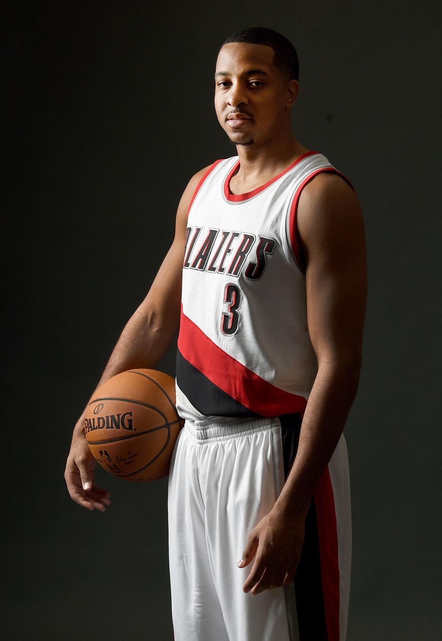 Portland Trail Blazers guard C.J. McCollum (3) poses for a photograph during NBA basketball media day in Portland, Ore., Monday, Sept. 26, 2016. (AP Photo/Steve Dykes)