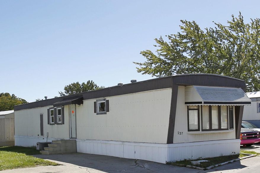 An eviction notice remains taped to the front door of a mobile home where Amber Pasztor used to reside, Tuesday, Sept. 27, 2016 in Countryside Village Mobile Home Park in Fort Wayne, Ind. Northern Indiana prosecutors say they will file formal charges later this week against Amber Pasztor, arrested on two preliminary murder counts after two bodies believed to be those of her son and daughter were found in a car. Elkhart County Prosecutor's office spokeswoman Shelley Murphy says a magistrate will review probable cause information in the case Wednesday and formal charges will be filed later this week against Pasztor. (Chad Ryan/The Journal-Gazette via AP)