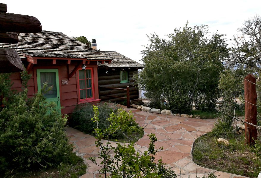 In this Wednesday, May 27, 2015 photo, a National Park cabin is seen on the south rim of the Grand Canyon in Ariz. Arizona's rebounding state parks system plans to more than quadruple the number of cabins at parks statewide, one of several projects on the drawing board to improve and expand parks facilities less than a decade after the system struggled to keep parks open as legislators raided funding during the Great Recession. (AP Photo/Matt York)