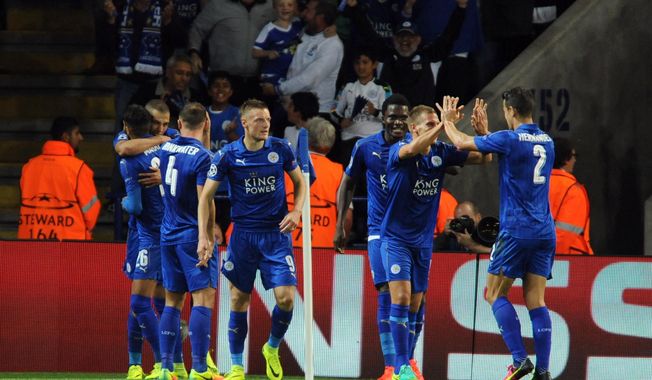 Leicester&#x27;s players celebrate the opening goal of their team during the Champions League Group G soccer match between Leicester City and FC Porto at King Power Stadium, Leicester, England, Tuesday, Sept. 27, 2016. (AP Photo/Rui Vieira)