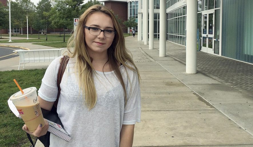 In this Tuesday, Sept. 20, 2016 photo, Manchester Community College student Jeslyn Lamonte, of Vernon, Conn., stands on the school's campus in Manchester, Conn. She said she intends to transfer to UConn after two years to save on tuition and avoid significant education debt. (AP Photo/Michael Melia)