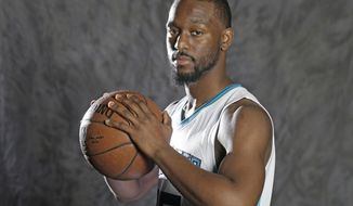In this photo taken Sept. 26, 2016, Charlotte Hornets&#39; Kemba Walker poses for a photo during the NBA basketball team&#39;s media day in Charlotte, N.C. Walker has been on the verge of becoming an NBA All-Star. Nicolas Batum and other teammates believe this will be the year the sixth-year pro finally breaks through. (AP Photo/Chuck Burton)