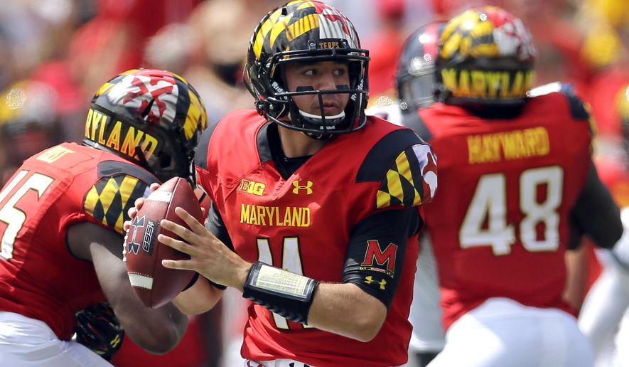 FILE - In this Sept. 5, 2015, file photo, Maryland quarterback Perry Hills looks for a receiver in the first half of an NCAA college football game against Richmond,in College Park, Md. Though first-year coach DJ Durkin is known for his defensive prowess, Maryland is unbeaten because of an attack that has rung up 123 points, second-most in school history after three games. (AP Photo/Patrick Semansky, FIle)