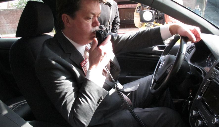 In this Feb. 10, 2016 photos, Andrew Wisniewski, an operations manager for Smart Start of Maryland, demonstrates how an ignition interlock device works in Annapolis, Md. The devices are put in cars to stop drunk drivers from operating their vehicles. (AP Photo/Brian Witte)  **FILE**