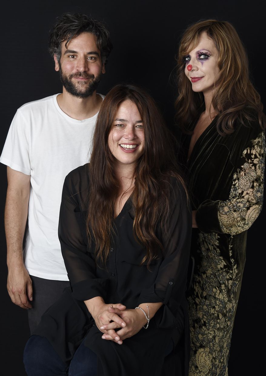 In this Sept. 1, 2016 photo, singer Rachael Yamagata, center, poses with Josh Radnor, director of Yamagata's music video for her song "Let Me Be Your Girl," and actress Allison Janney, who appears in the video, at H.Q. Avalon Studios in Los Angeles. (Photo by Chris Pizzello/Invision/AP)