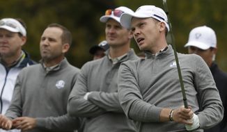 Europe&amp;#8217;s Danny Willett watches his drive with teammate Europe&amp;#8217;s Justin Rose and Europe&amp;#8217;s Sergio Garcia during a practice round for the Ryder Cup golf tournament Wednesday, Sept. 28, 2016, at Hazeltine National Golf Club in Chaska, Minn. (AP Photo/Chris Carlson)