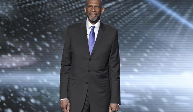 FILE - In this July 13, 2016, file photo, Kareem Abdul-Jabbar presents a tribute to Muhammad Ali at the ESPY Awards at the Microsoft Theater in Los Angeles. Abdul-Jabbar&#x27;s next book will be a fond look back at his long friendship with John Wooden, the celebrated basketball coach at UCLA. &amp;quot;Coach Wooden and Me&amp;quot; will be published next June and will combine personal memories and lessons learned from his friend and mentor, Grand Central Publishing told The Associated Press on Wednesday, Sept. 28. (Photo by Chris Pizzello/Invision/AP, File)