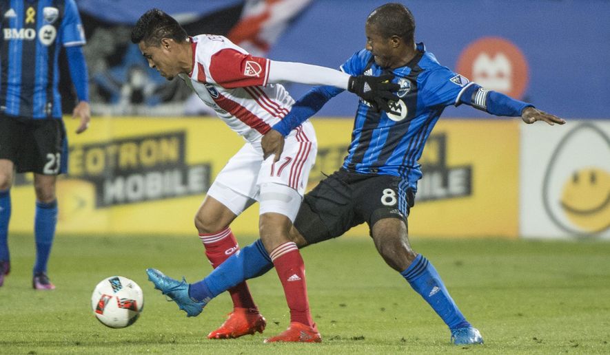 Montreal Impact midfielder Patrice Bernier (8) pokes the ball away from San Jose Earthquakes midfielder Darwin Ceren, right, during the first half of a soccer game, Wednesday, Sept. 28, 2016 in Montreal. (Paul Chiasson/The Canadian Press via AP)