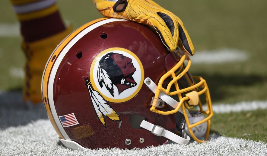 In this photo taken Sept. 18, 2016, a Washington Redskins helmet is seen on the sidelines during the first half of an NFL football game against the Dallas Cowboys in Landover, Md.  (AP Photo/Nick Wass) **FILE**