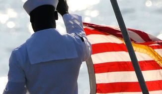 An sailor prepares to shift colors aboard the USS Bataan (Instagram, U.S. Navy)