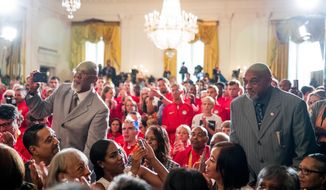 1968 US Olympic athletes Tommie Smith, right, and John Carlos, left, stand as they are recognized by President Barack Obama during a ceremony in the East Room of the White House in Washington, Thursday, Sept. 29, 2016, where the president honored the 2016 United States Summer Olympic and Paralympic Teams. Smith and Carlos extended their gloved hands skyward in racial protest during the playing of &amp;quot;The Star-Spangled Banner&amp;quot; after Smith received the gold and Carlos the bronze medal in the 200 meter run at the Summer Olympic Games in Mexico City 1968. (AP Photo/Andrew Harnik)