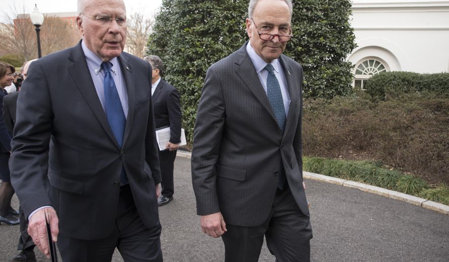 FILE - In this March 16, 2016 file photo, Sen. Patrick Leahy, D-Vt., the ranking member of the Senate Judiciary Committee, left, and Sen. Chuck Schumer, D-N.Y., right, depart the White House, in Washington. Schumer and Leahy said multiple states are violating federal law with their mail-in voter registration deadlines for the November election, blocking applications as many as three days earlier than other states and potentially disenfranchising thousands of people. In a letter this week, the pair have asked the U.S. Election Assistance Commission to intervene and work with election officials in nine states to ensure compliance with the National Voting Rights Act. (AP Photo/J. Scott Applewhite, File)