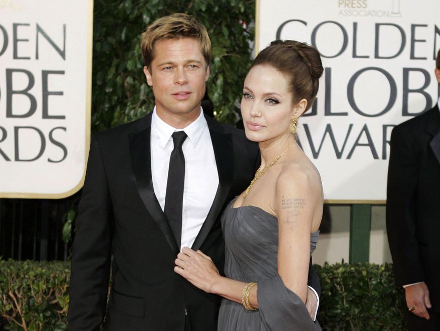 FILE - In this Jan. 15, 2007 file photo, Brad Pitt, and actress Angelina Jolie arrive for the 64th Annual Golden Globe Awards in Beverly Hills, Calif. The couple have reached a temporary agreement that will allow the actor to visit with his six children, sources familiar with the arrangement told The Associated Press on Friday, Sept. 30, 2016. Jolie Pitt filed for divorce last week. (AP Photo/Mark J. Terrill, File)
