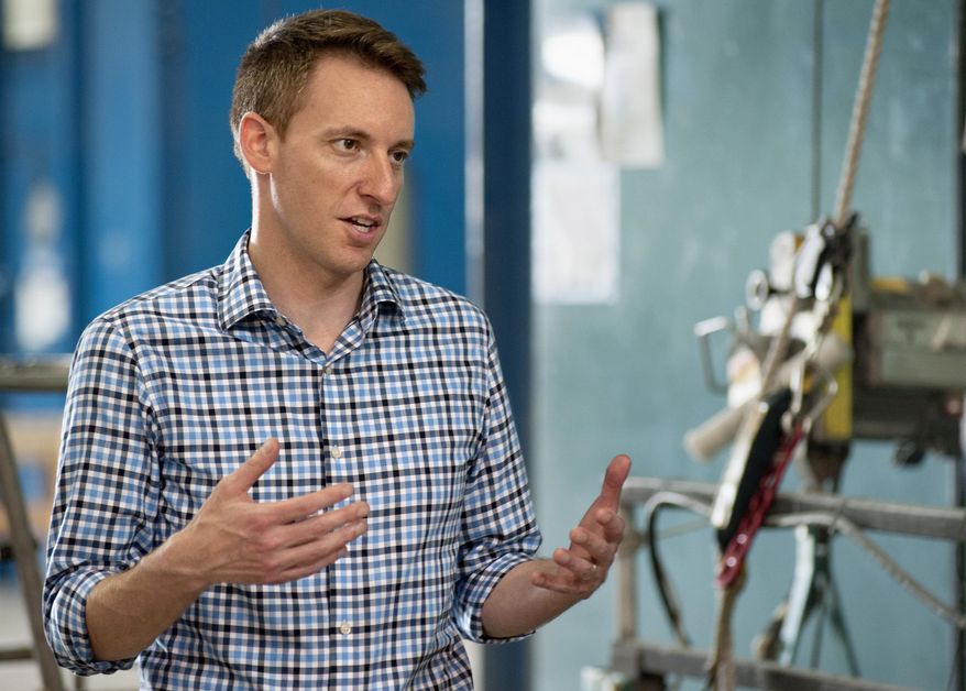 FILE - In this Aug. 12, 2016 file photo, Missouri Secretary of State Jason Kander, a Democratic candidate for the U.S. Senate, tours the International Union of Painters and Allied Trades training facility in Chesterfield, Mo. A debate Friday, Sept. 30, 2016, featuring Republican Sen. Roy Blunt and his Democratic challenger, Kander, could have ramifications far beyond the borders of Missouri. Control of the Senate is up for grabs in November, and polls show a close race in Missouri. (AP Photo/Sid Hastings, File)