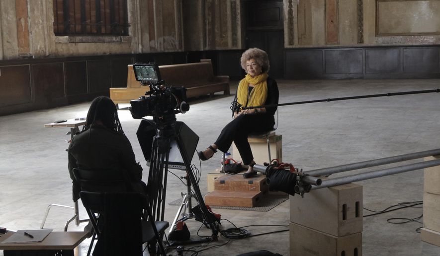 This image released by Netflix shows, Ava Duvernay, left, and Angela Davis during the filming of the documentary, "The 13th." DuVernay’s documentary on mass incarceration opened the festival Friday, Sept. 30, 2016, the first documentary to ever mark the start of the Film Society of Lincoln Center’s prestigious festival. (Netflix via AP)