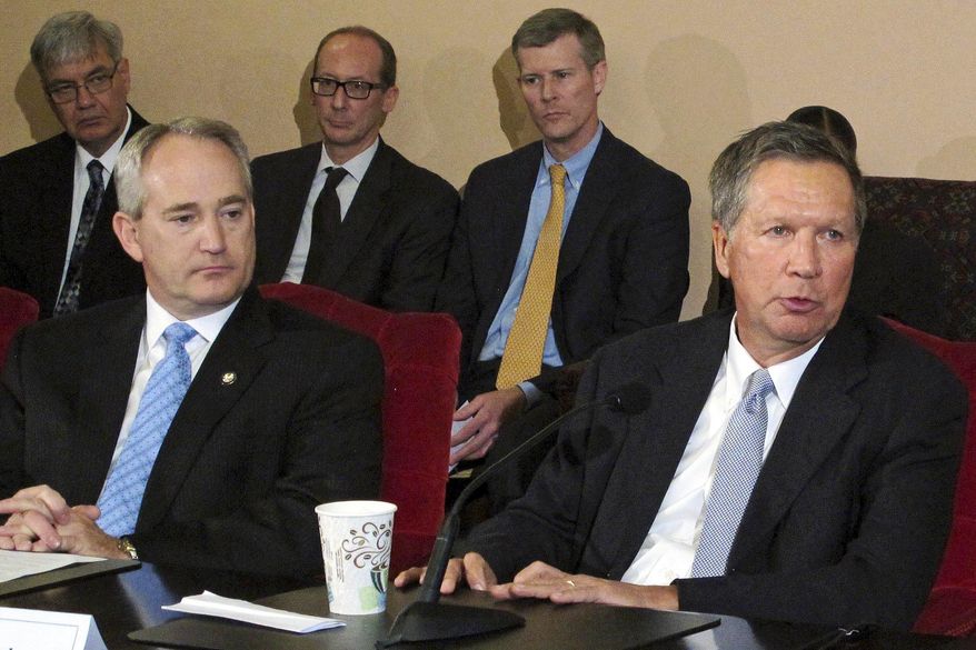 FILE – In this June 26, 2015, file photo, Ohio Gov. John Kasich, front right, and Ohio Senate President Keith Faber, front left, both Republicans, discuss the state budget with reporters, as other officials watch at the Statehouse in Columbus, Ohio. Ohio Senate President Keith Faber is a lead sponsor of a bill passed by the state Senate on Wednesday, Sept. 28, 2016, that would create a review process for at least 25 state agencies under the governor’s authority, allowing lawmakers to more easily eliminate agencies. (AP Photo/Kantele Franko, File)