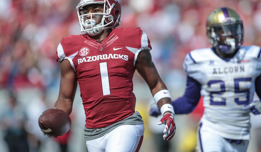 Arkansas wide receiver Jared Cornelius scores a touchdown during the first quarter of an NCAA football game against Alcorn State, Saturday, Oct. 1, 2016, in Little Rock, Ark. (AP Photo/ Chris Brashers)