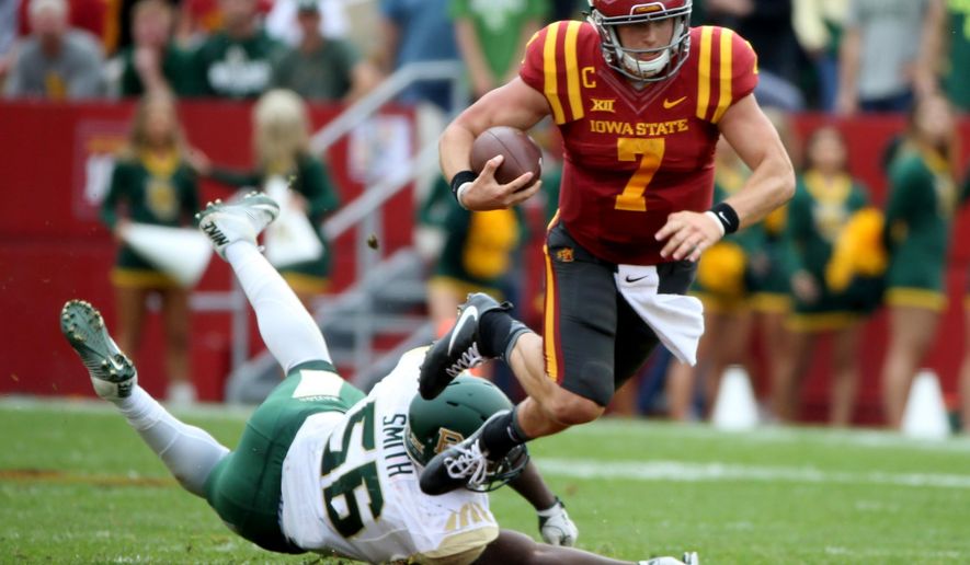Iowa State quarterback Joel Lanning is tripped up by Baylor defensive end K.J. Smith during the first half of an NCAA college football game, Saturday, Oct. 1, 2016, in Ames, Iowa. (AP Photo/Justin Hayworth)