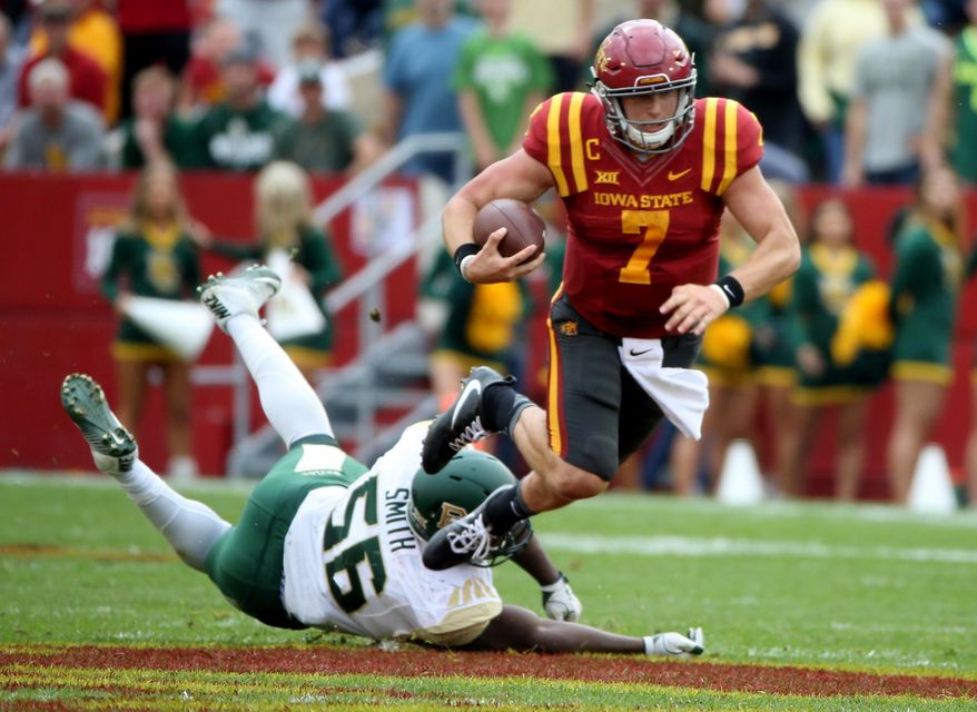 Iowa State quarterback Joel Lanning is tripped up by Baylor defensive end K.J. Smith during the first half of an NCAA college football game, Saturday, Oct. 1, 2016, in Ames, Iowa. (AP Photo/Justin Hayworth)
