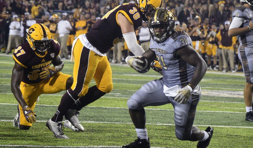 Western Michigan's Jarvion Franklin (31) looks for the goal line during an NCAA college football game against Central Michigan, Saturday, Oct. 1, 2016, in Mount Pleasant, Mich. (Jim Lahde /The Morning Sun via AP)