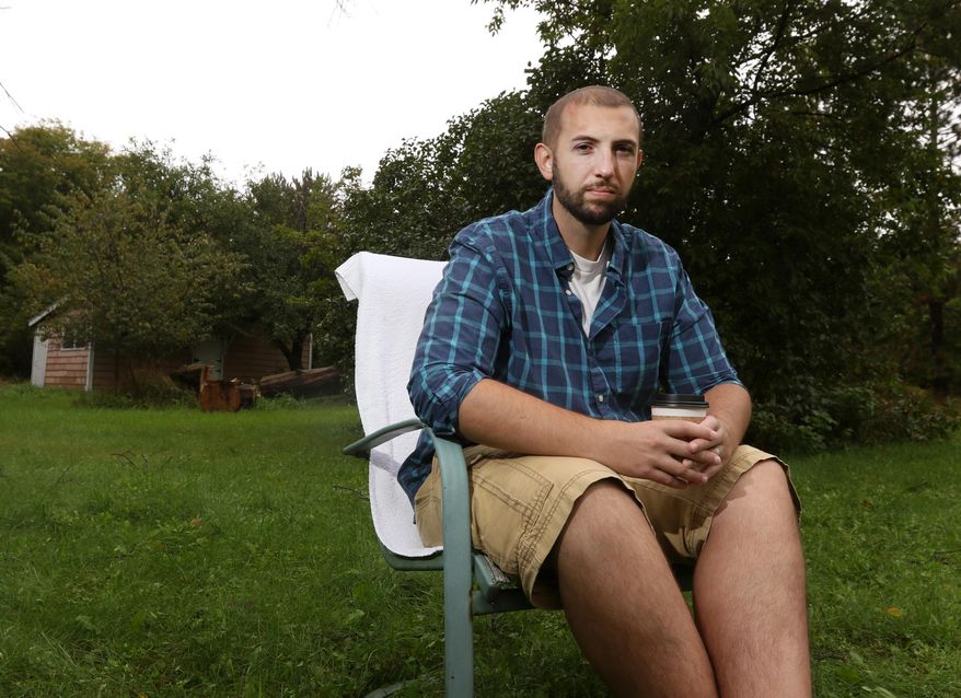 ADVANCE FOR MONDAY OCT. 3 AND THEREAFTER - In a Sept. 22, 2016 photo, Ben Kollock, poses for a photo at his home in Stevens Point, Wisc. Kollock survived luekemia on his own without medicinal marijuana and is now an advocate in the area and has helped push through legislation that lowered the fines for possession of the drug. (Jacob Byk/Stevens Point Journal via AP)