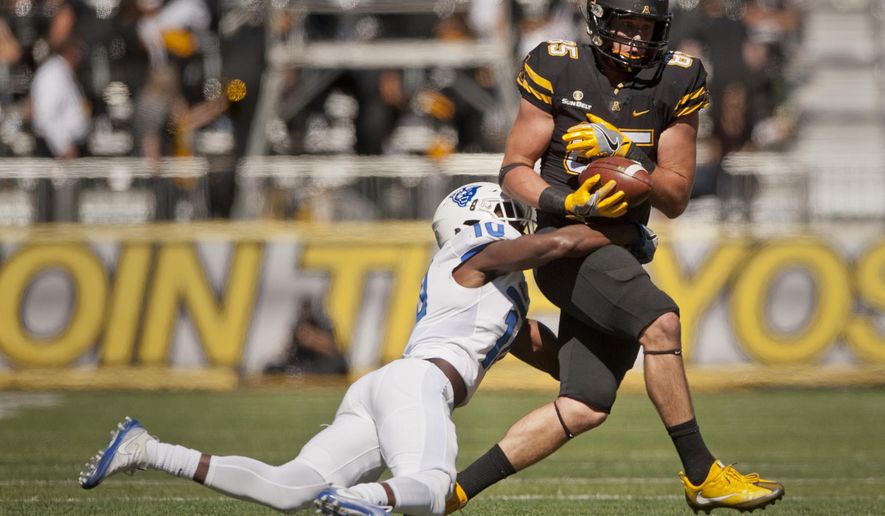 Appalachian State wide receiver Barrett Burns bobbles then catches a pass under pressure from Georgia State cornerback Chandon Sullivan in the second quarter of an NCAA college football game, Saturday Oct. 1, 2016 at Kidd Brewer Stadium in Boone, N.C. (Walt Unks/The Winston-Salem Journal via AP)