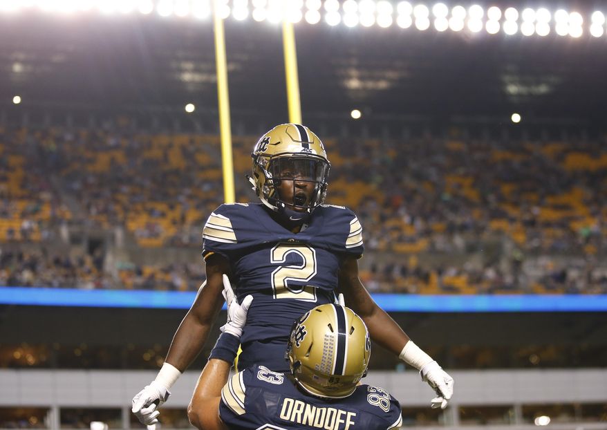 Pittsburgh wide receiver Maurice Ffrench (2) is held up by Pittsburgh tight end Scott Orndoff (83) after scoring a touchdown against Marshall during the first half of an NCAA college football game in Pittsburgh on Saturday, Oct. 1, 2016. (AP Photo/Jared Wickerham)